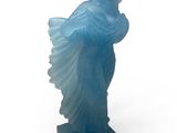statue of a woman in a blue dress on a white background