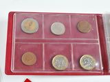a picture of a box of coins and a pen on a table