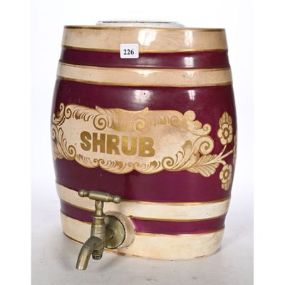 a small wooden barrel with a faucet attached to it