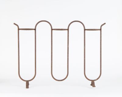 a close up of a metal rack on a white background
