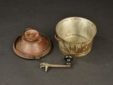 a small cup and saucer sitting on a table