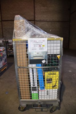 a cart with a lot of items in it in a warehouse