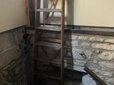 a ladder that is leaning against a wall in a room
