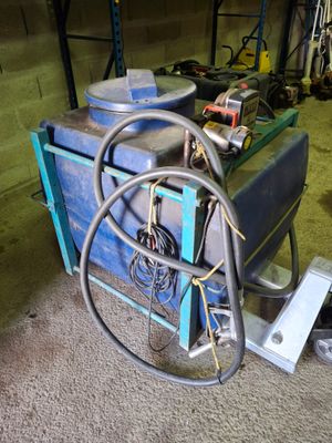 a machine that is sitting on the floor in the garage