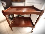 a small wooden table with a shelf on top of it