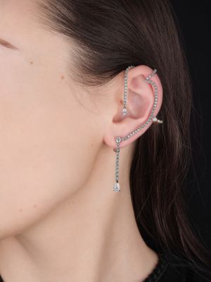 the ear cuff is adorned with a chain and rhines