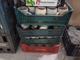a stack of plastic crates with a sign on it