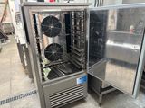 a refrigerator that has two fans inside of it