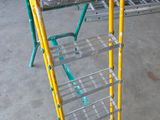 a ladder that is sitting on the floor in the garage