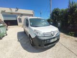 a white van parked in front of a garage