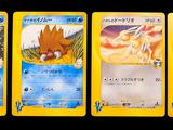 four pokemon cards are lined up in a row on a black background
