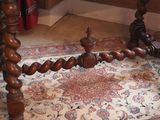 an image of a wooden table with a rug on the floor