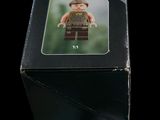 a box with a lego figure in it on a black background