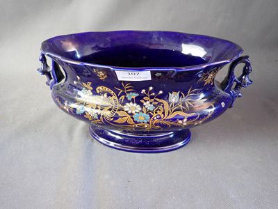 a purple bowl with a floral design on it