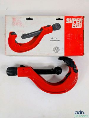a close up of a pair of red pipe cutters on a white surface