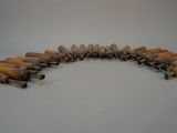 several wooden dows arranged in a circle on a white surface
