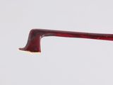 the glasses are made out of wood and have a red frame