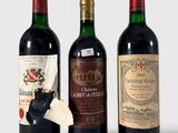 trois bouteilles de vin posées l'une à côté de l'autre sur une table