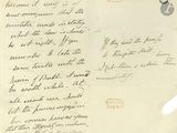une vieille lettre manuscrite sur laquelle figure la photo d'un homme