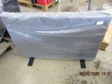 a large piece of plastic sitting on a pallet in a warehouse