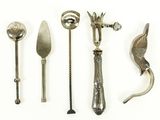 five different types of silverware on a white surface