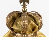 a gold crown with a cross on top of it