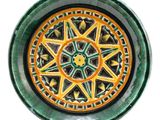 a picture of a green and yellow plate with a star design