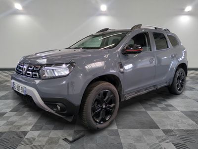 a picture of a grey dacia parked on a checkered floor
