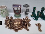 a table with a lot of antique items on it