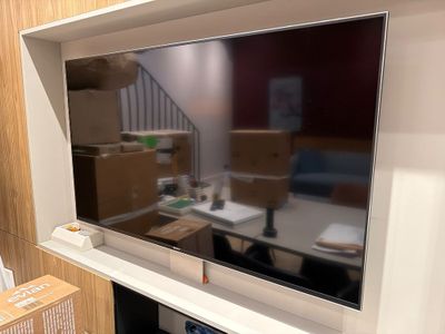 a flat screen tv mounted on a wall in a living room