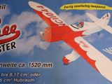 a red and white toy airplane with a blue sky in the background
