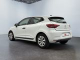 the rear end of a white car in a white room