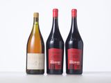 three bottles of wine sitting on top of a table next to each other