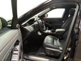 the interior of a car with the door open and the driver ' s seat down