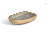 a small bowl that is sitting on a white surface