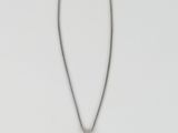 a necklace with a black stone on a silver chain