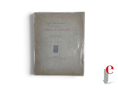 an old book on a white surface with a red and black logo