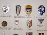 many different types of badges displayed on a piece of paper