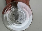 a person holding a glass of water in their hand