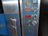 an image of a stainless steel oven with electronic controls