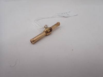 a small piece of metal on a white surface
