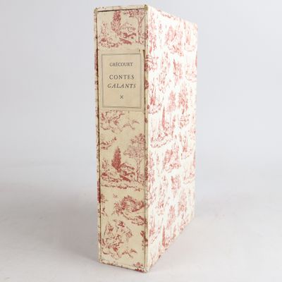 un livre à la couverture rouge et blanche posé sur une table