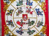 a red and white scarf with a picture of knights on it