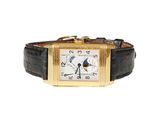 an image of a gold wrist watch with a black leather band