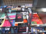 a lot of books that are sitting on a table