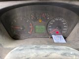 a close up of the dashboard of a car with a sticker on it