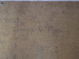 a brown box with writing on it sitting on the floor