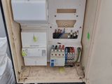 a cabinet that has a lot of wires and wires in it