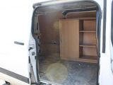 a white van with open doors and shelves in the back of it