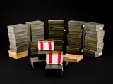 many stacks of boxes stacked on top of each other